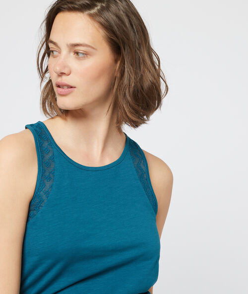 Top sin mangas de algod&oacute;n, motivos de encaje azul petr&oacute;leo.