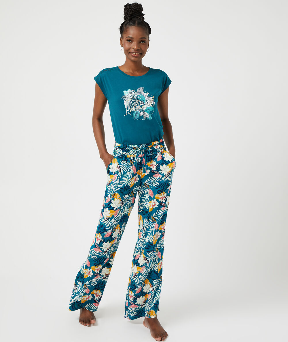 Pantalón estampado floral turquesa.