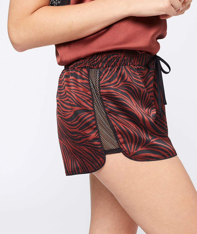 Pantalón corto estampado de cebra granate.