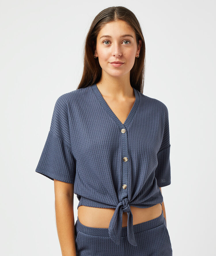 Top con lazada, tejido canalé azul.