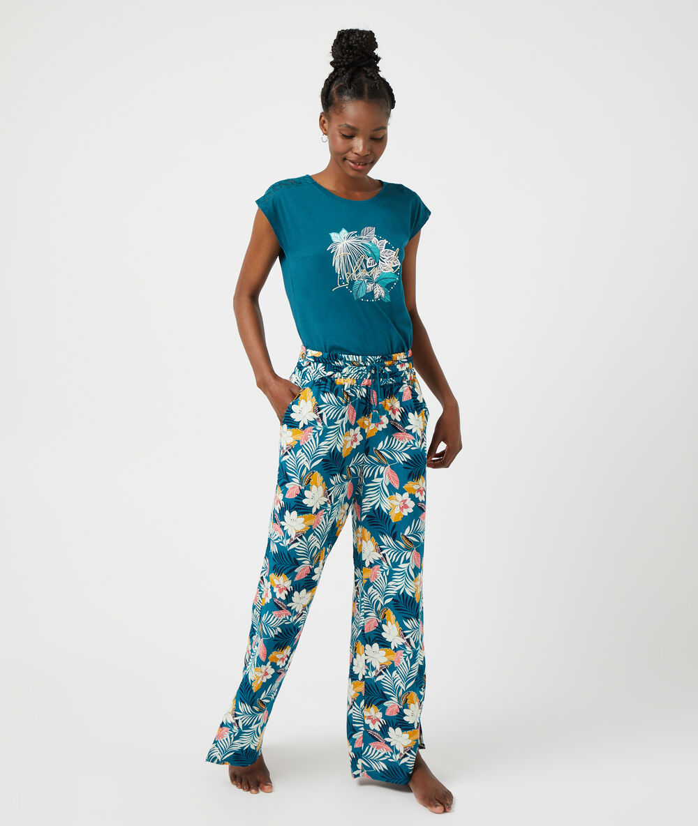Pantalón estampado floral turquesa.