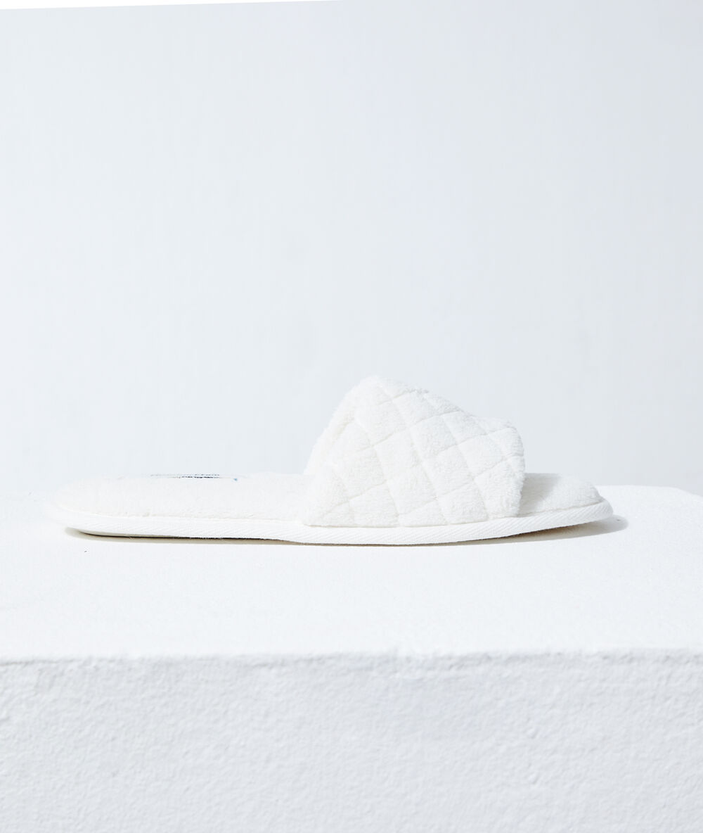 Zapatillas tipo chancla blanco.