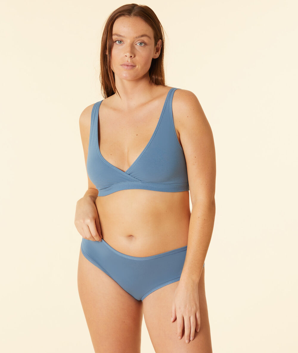Top reversible de algodón azul.