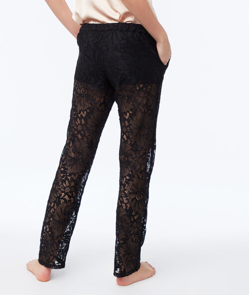 Pantalón largo encaje floral negro.
