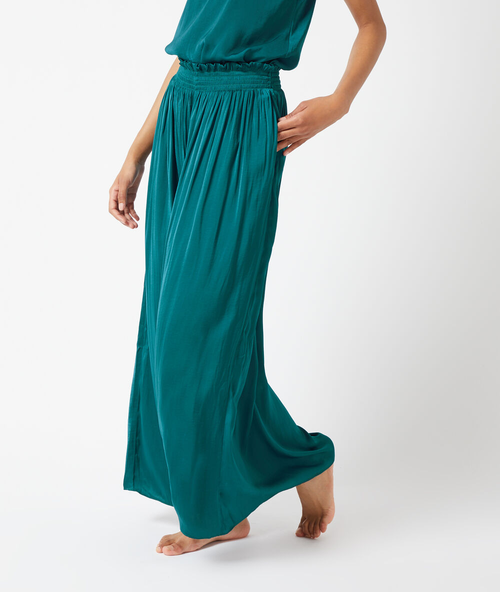 Pantalón de satén holgado turquesa.