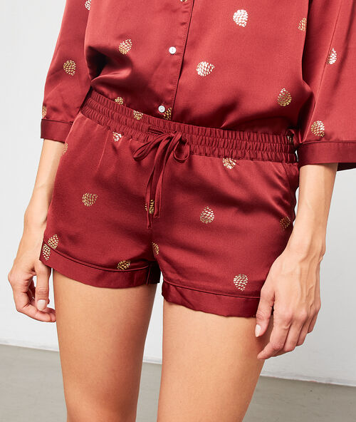 Pantalón pijama de satén estampado hojas terracota.