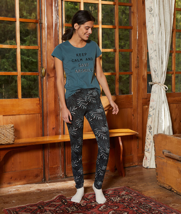 Pantalón ajustado estampado palmeras negro.