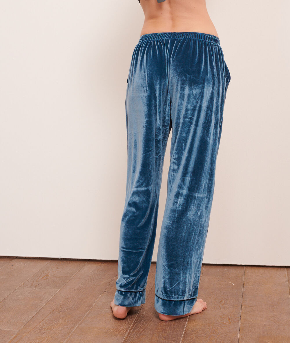 Pantalon en velours bleu petrole.
