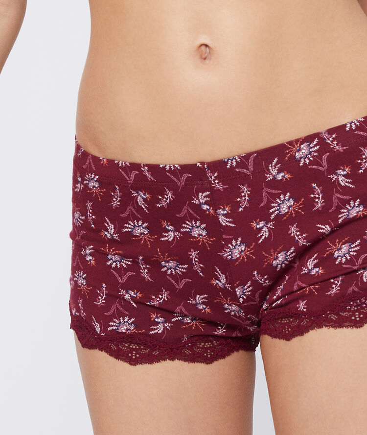 Pantalón corto de viscosa estampado floral burdeos.