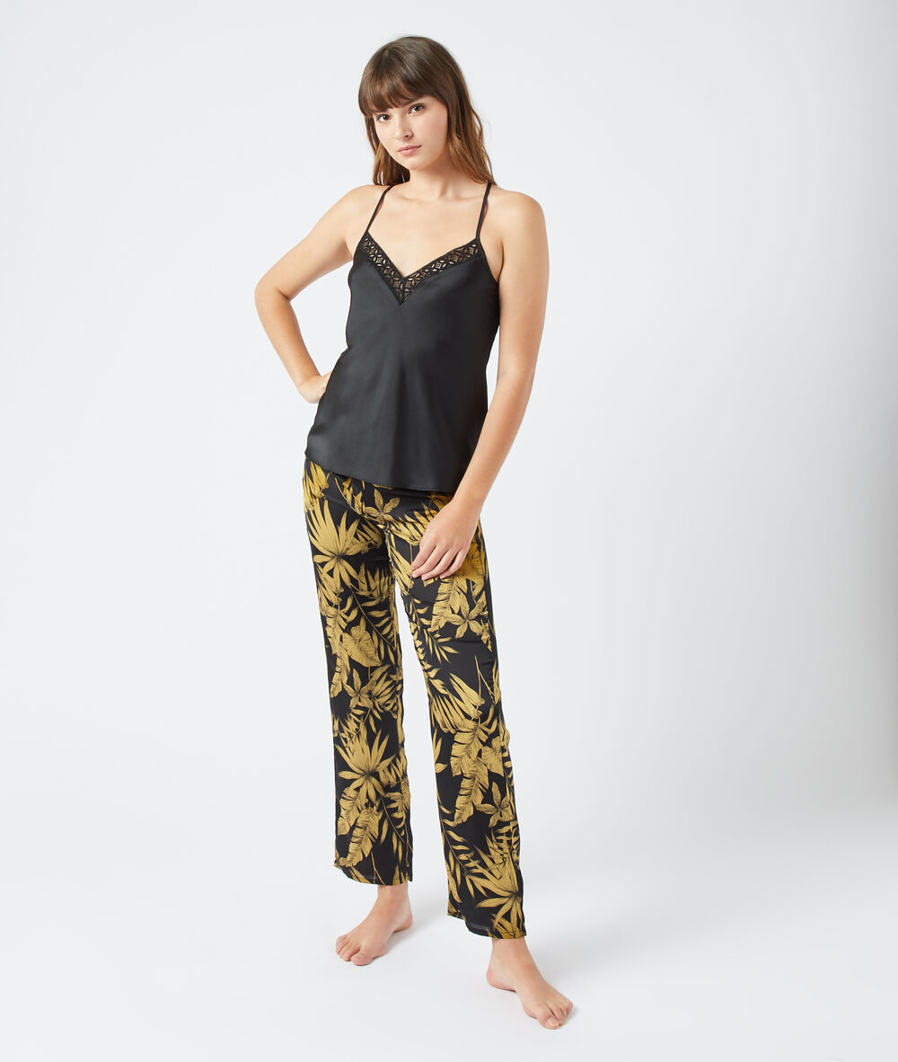 Pantalón estampado hojas negro.