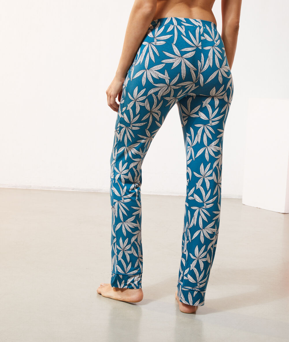 Pantalón estampado hojas turquesa.