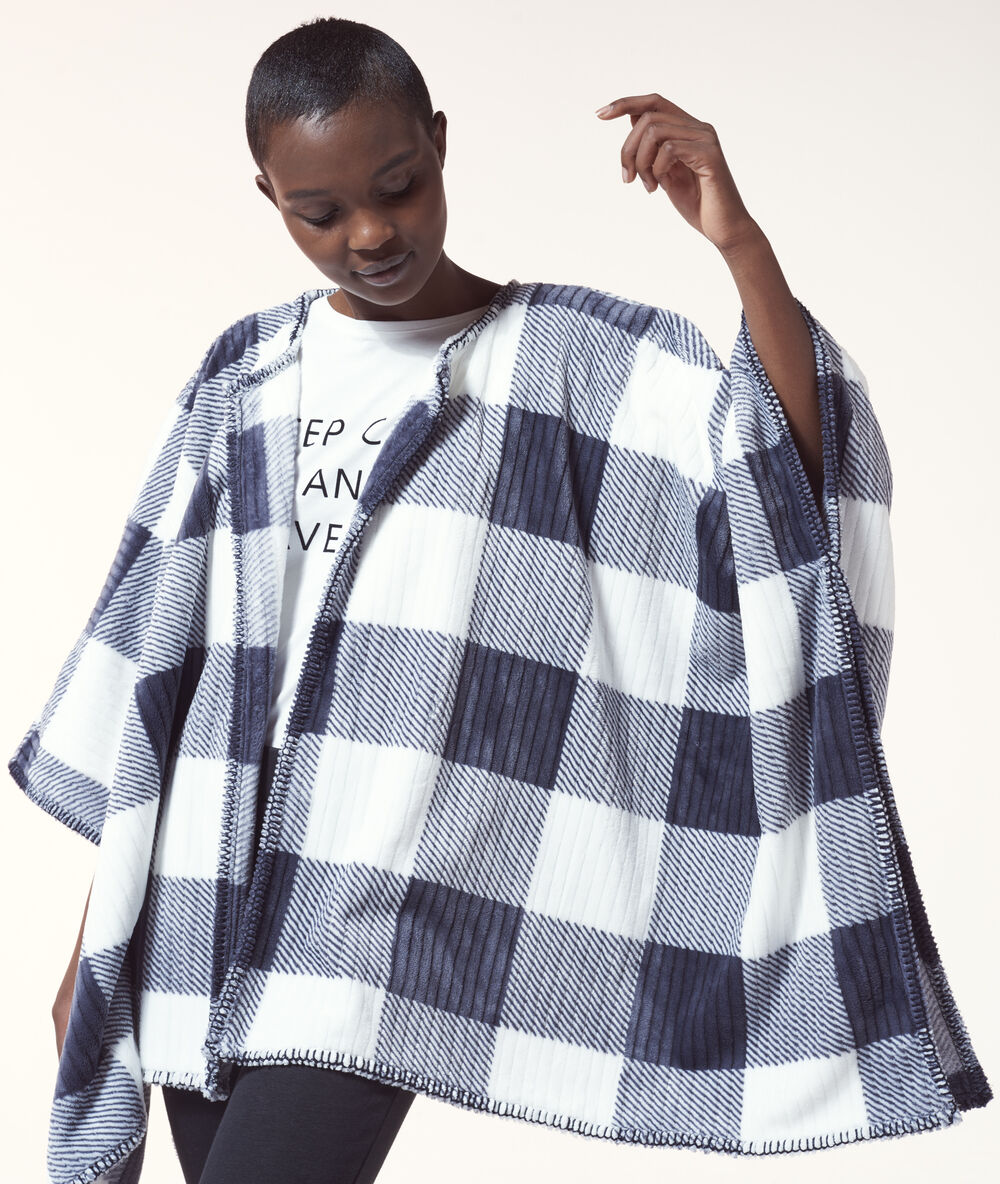 Veste polaire large à carreaux noir.