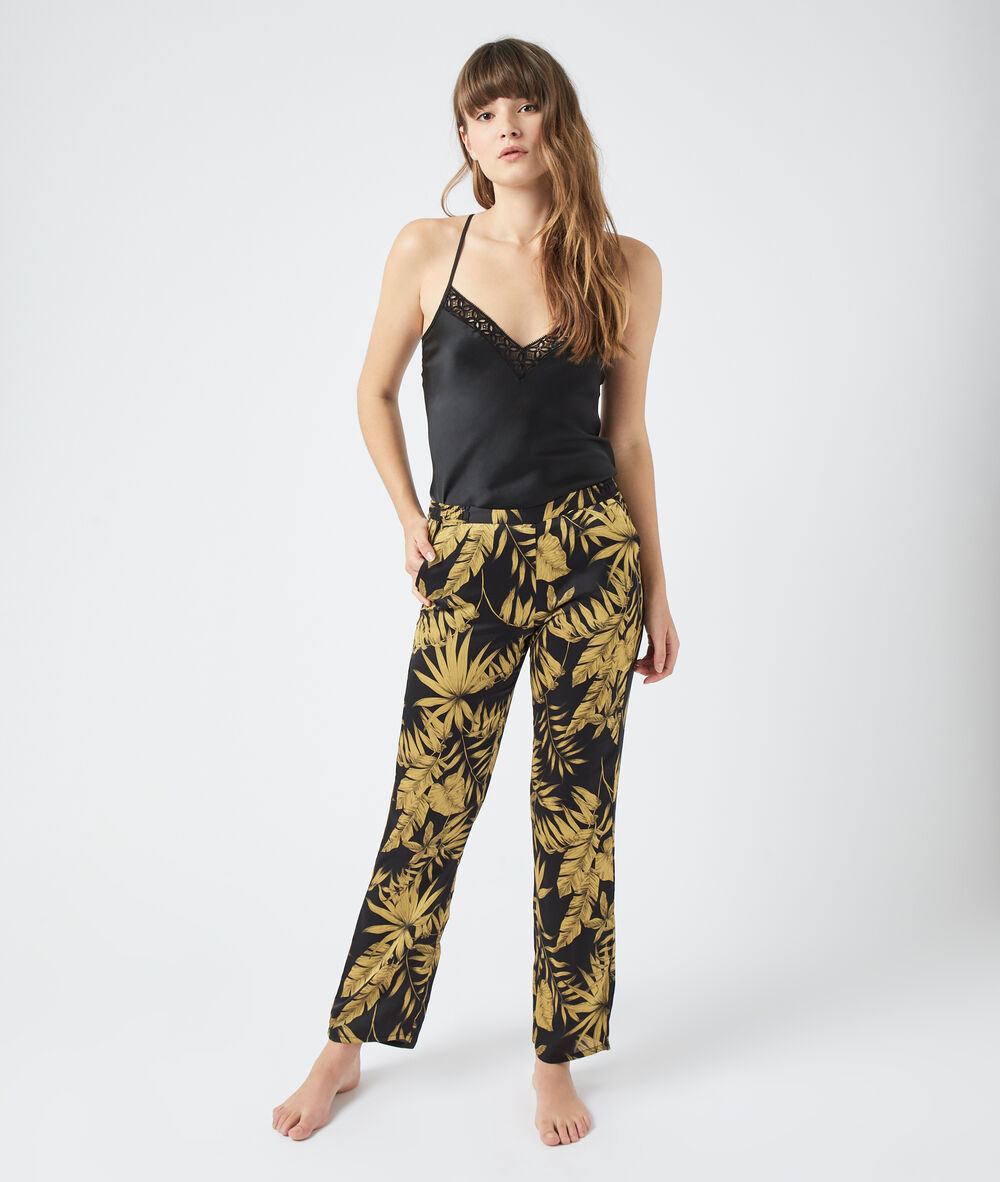 Pantalón estampado hojas negro.