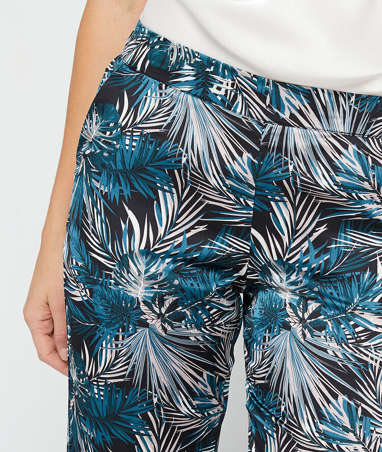 Pantalón estampado de hojas negro.