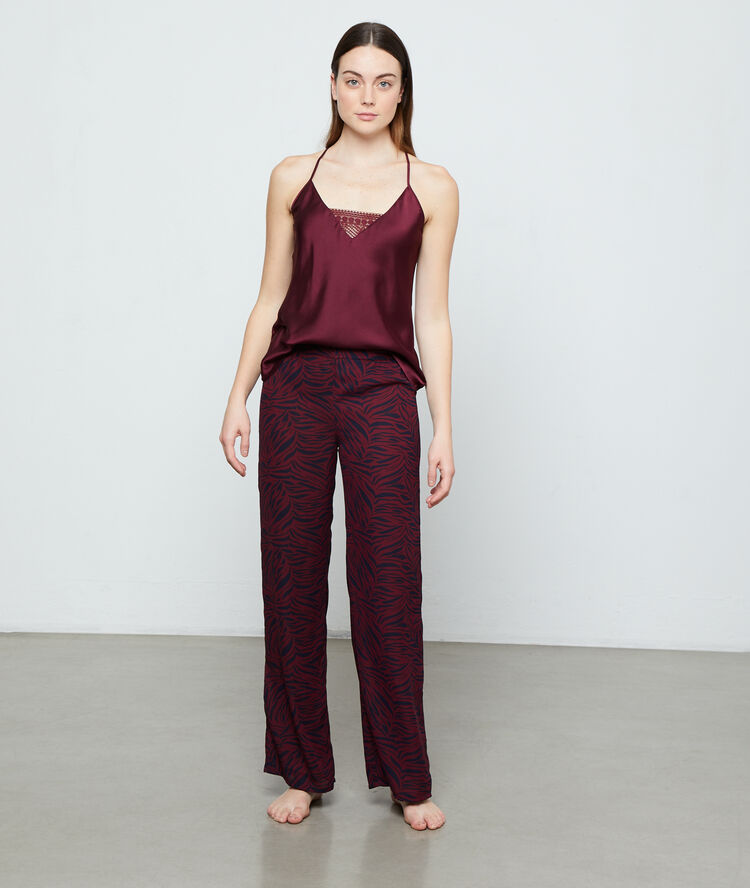 Pantalón estampado cebra granate.