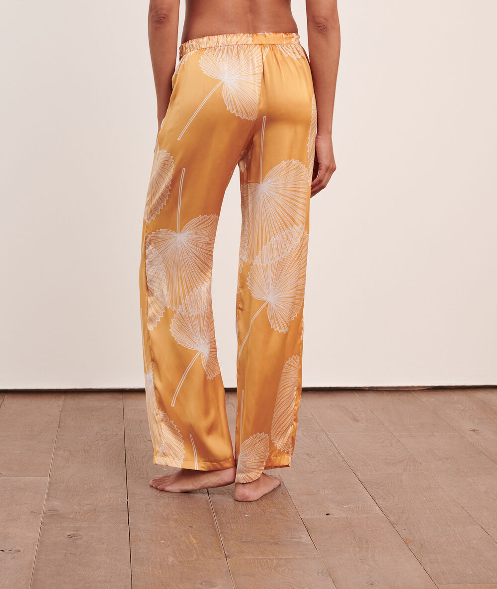 Pantalón de satén estampado amarillo.
