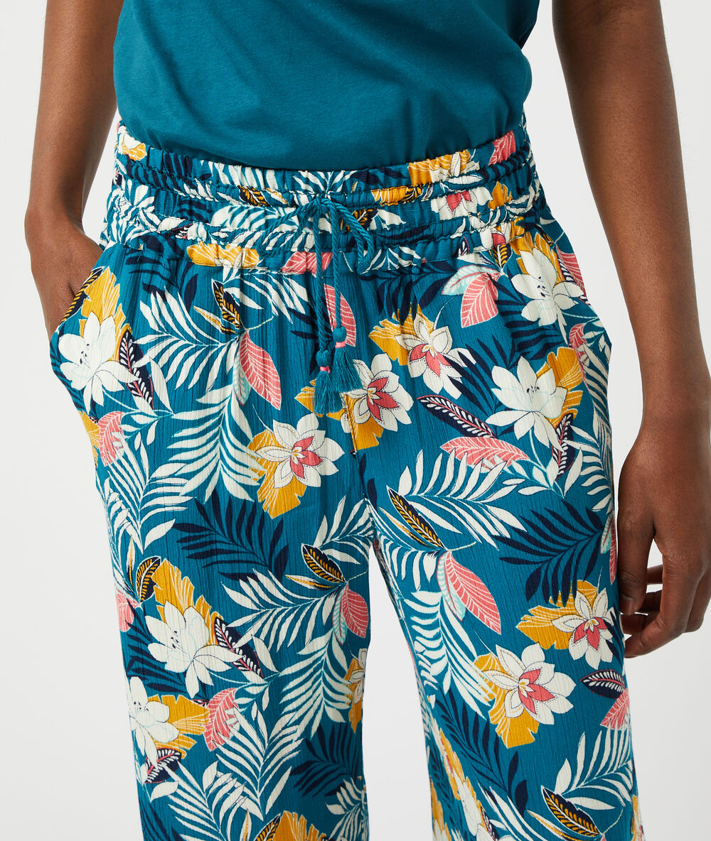 Pantalón estampado floral turquesa.