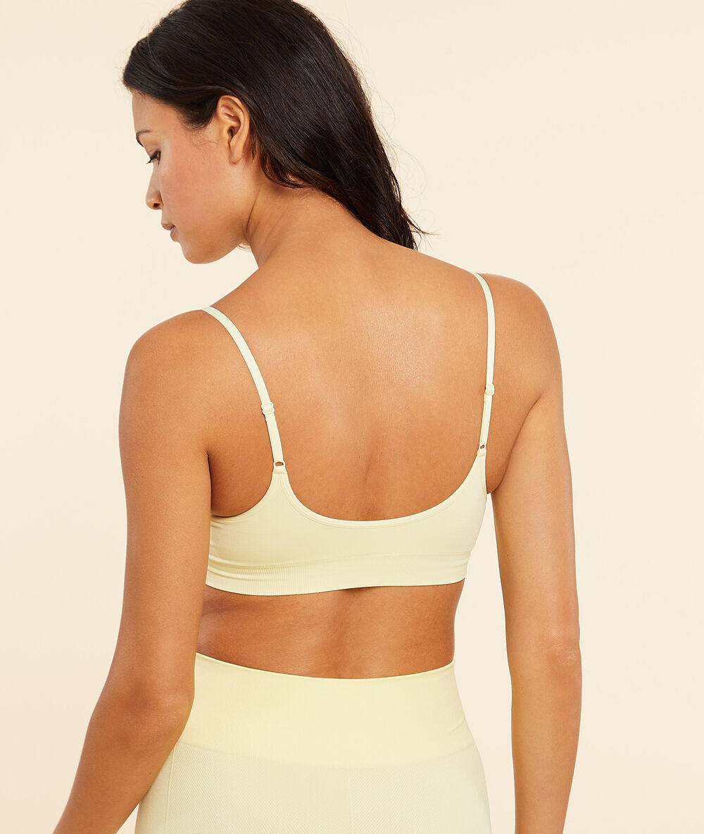 Top de yoga, sujeción media amarillo pálido.