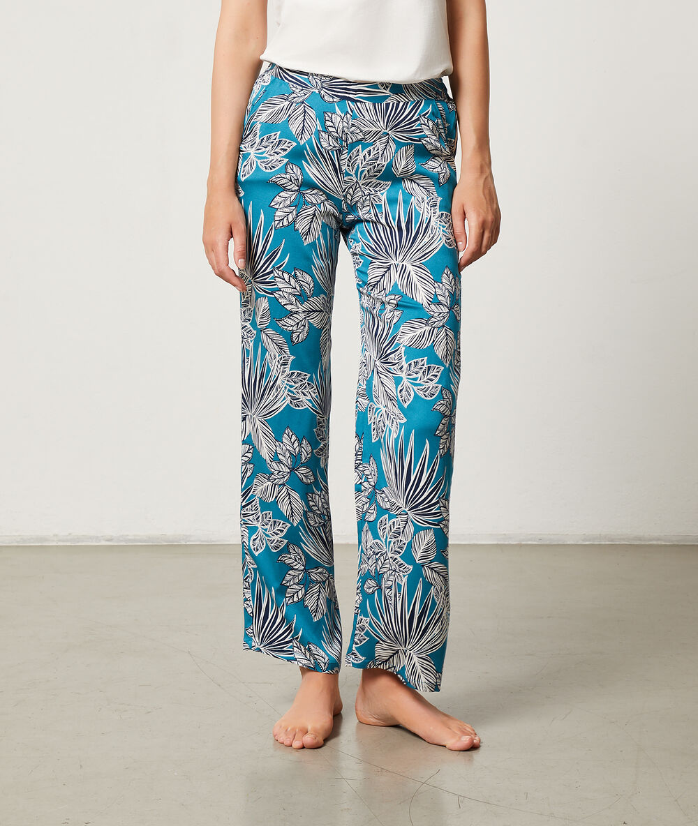 Pantalón estampado tropical turquesa.
