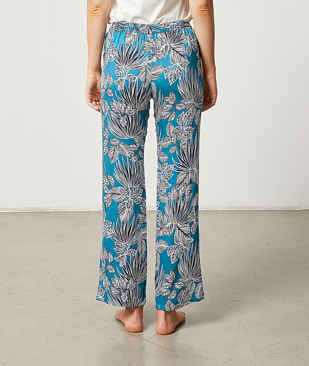 Pantalón estampado tropical turquesa.