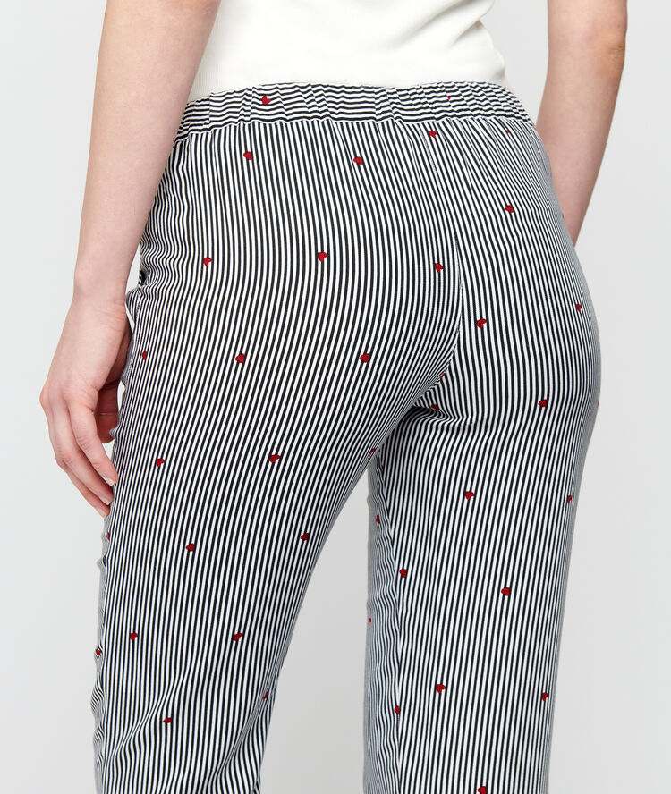 Pantalón estampado finas rayas crudo.