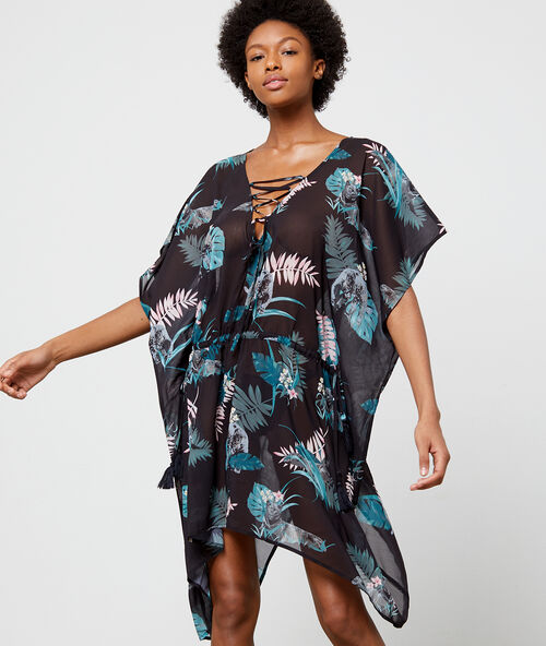 Mono playero estampado tropical estampado negro.