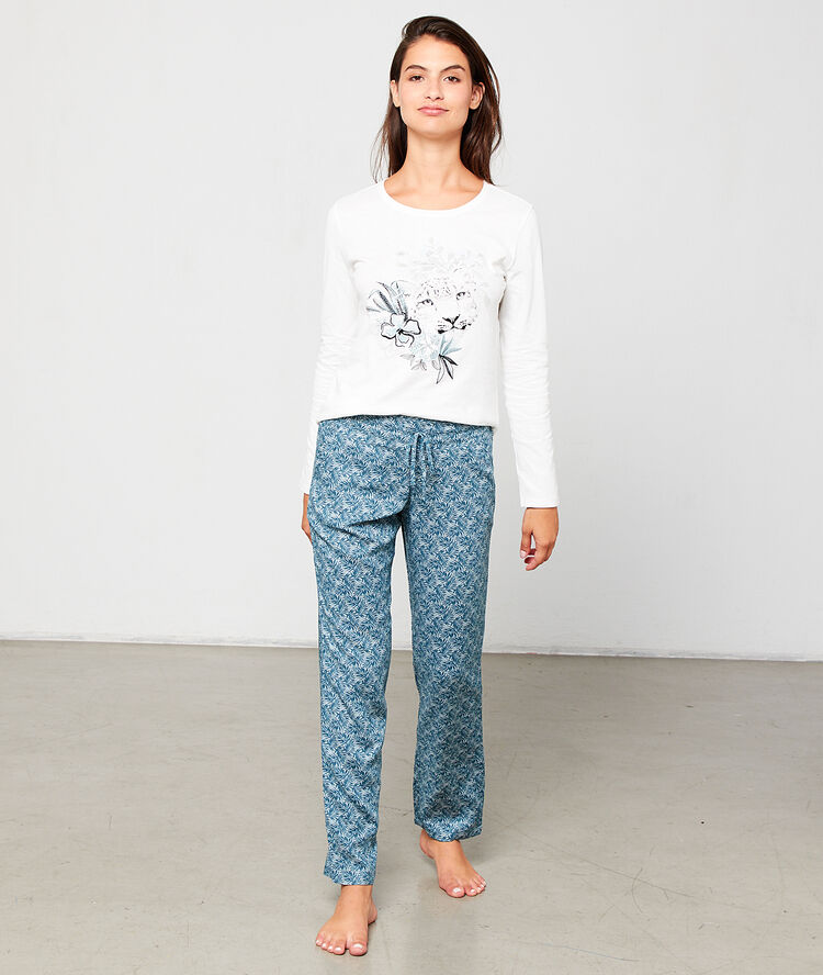 Pantalón estampado de hojas turquesa.