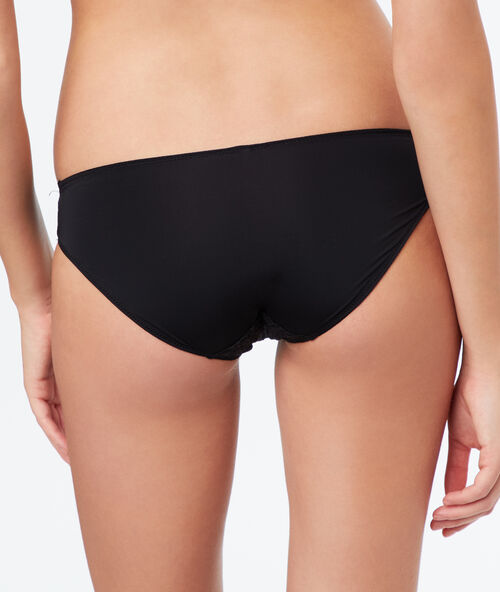 Braguita de encaje floral negro.