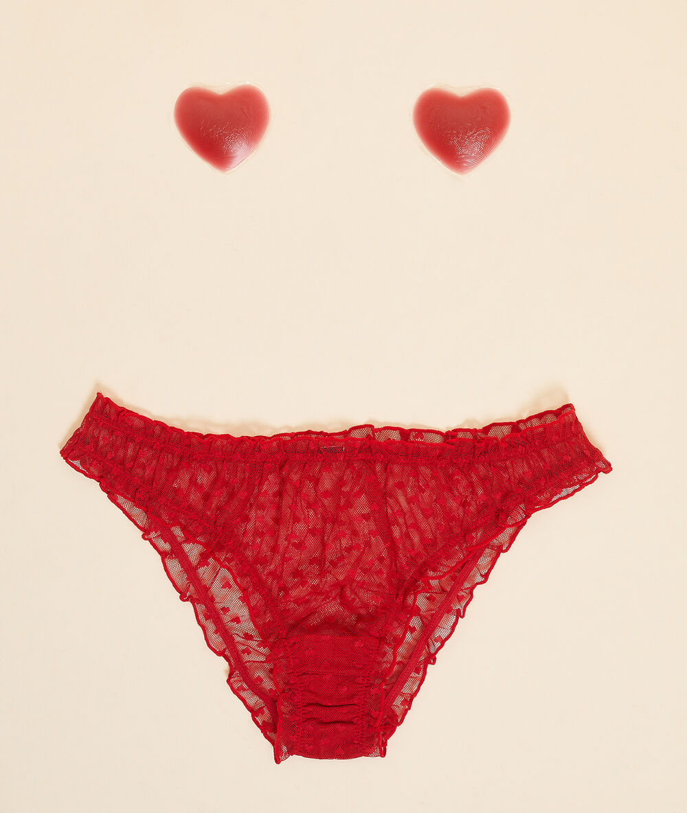 Conjunto de braguita y cubre pezones rosa.