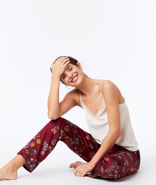 Pantalón de satén estampado floral granate.