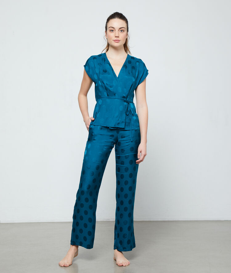 Pantalón estampado de lunares verde.