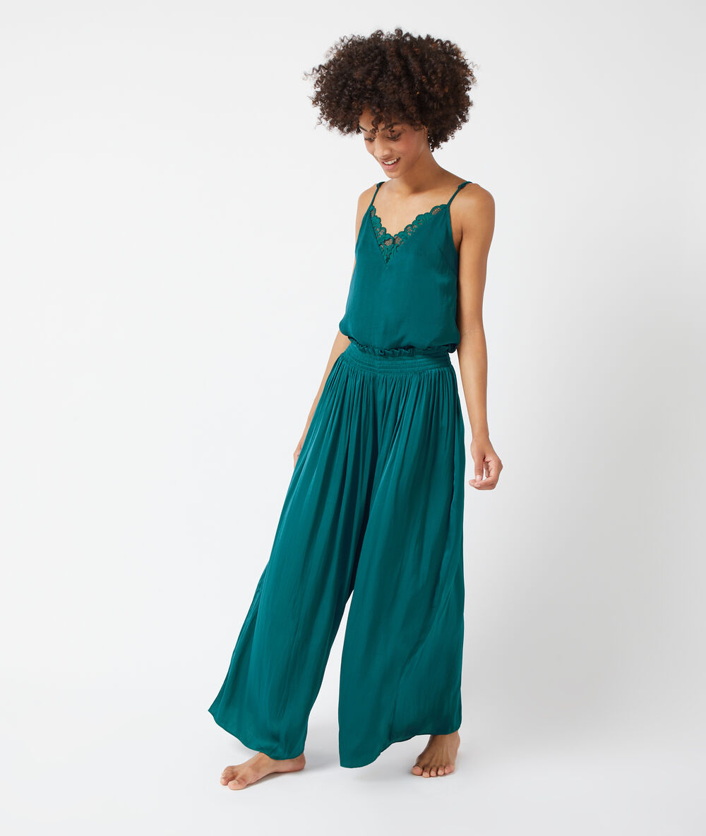 Pantalón de satén holgado turquesa.