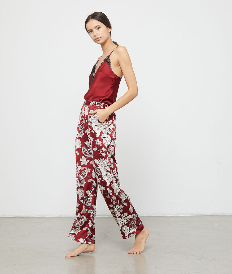 Pantalón holgado estampado floral burdeos.