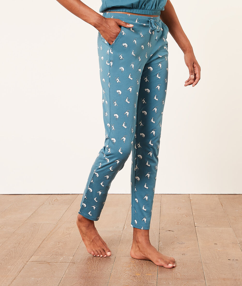 Pantalón pijama estampado gatos turquesa.