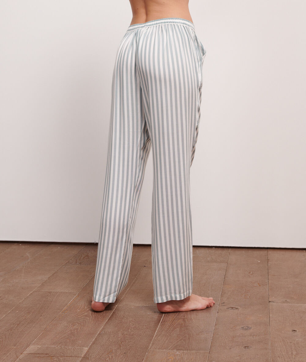 Pantalon à rayures imp fond vert.