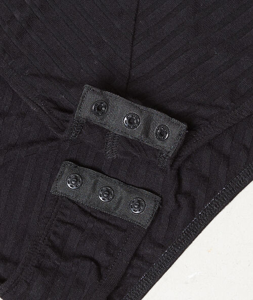 Body con tejido canal&eacute; negro.