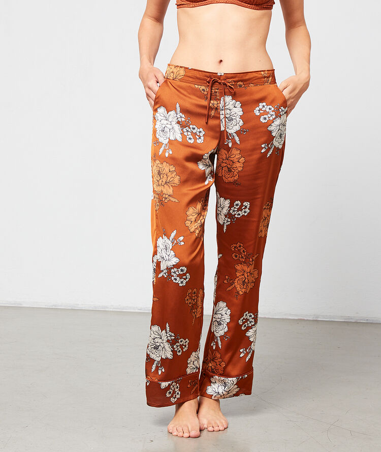 Pantalón de satén estampado floral marrón.