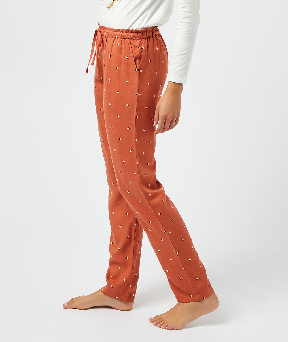 Pantalón largo estampado rojo teja.