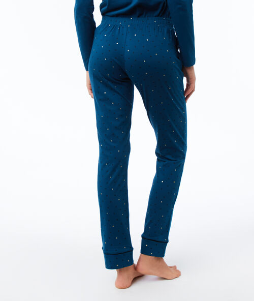Pantalón estampado de lunares azul.