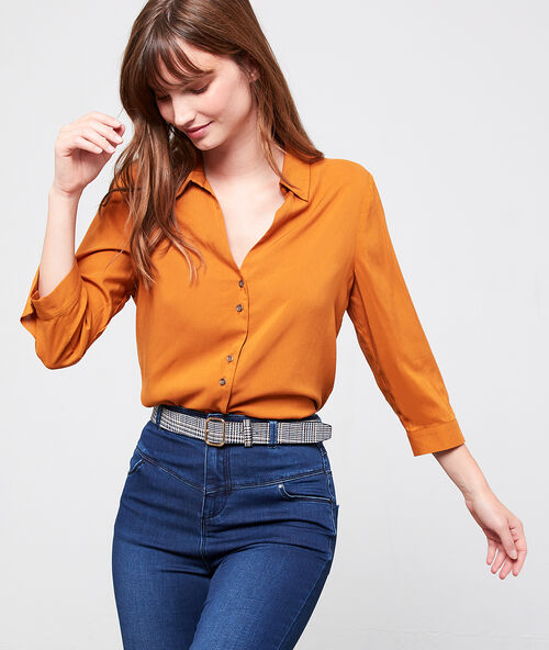Camisa con botones efecto ámbar mostaza.