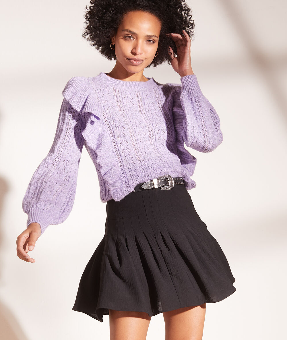 Falda plisada negro.