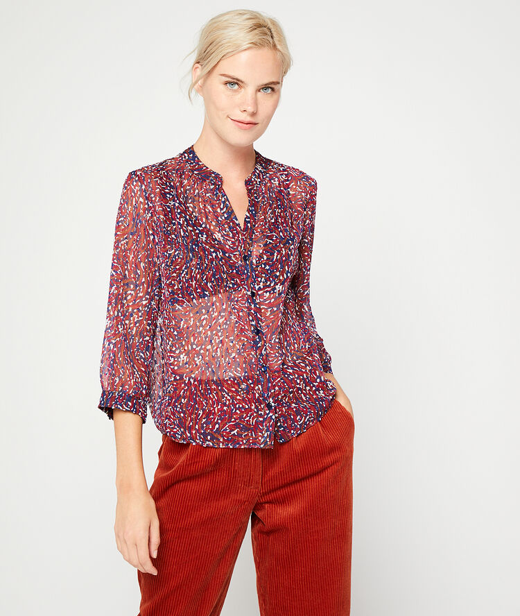 Blusa transparente de plumetis púrpura.
