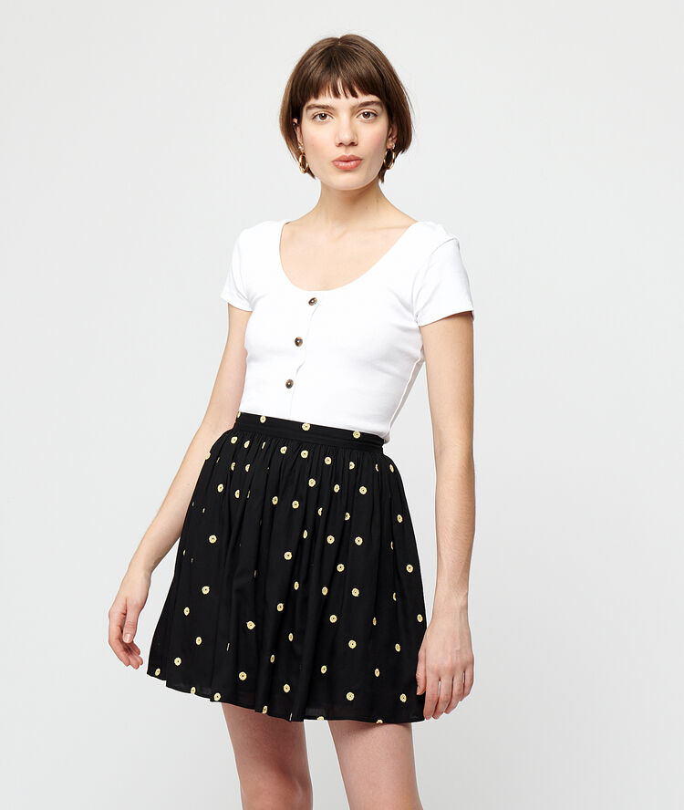 Falda patinadora estampado topos negro.