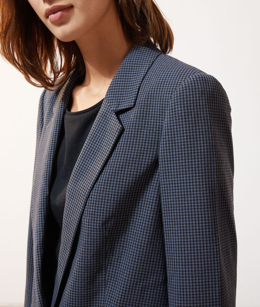 Veste de tailleur à carreaux noir.