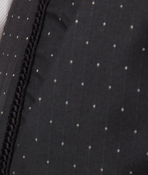 Pantalón cigarette estampado de lunares negro.