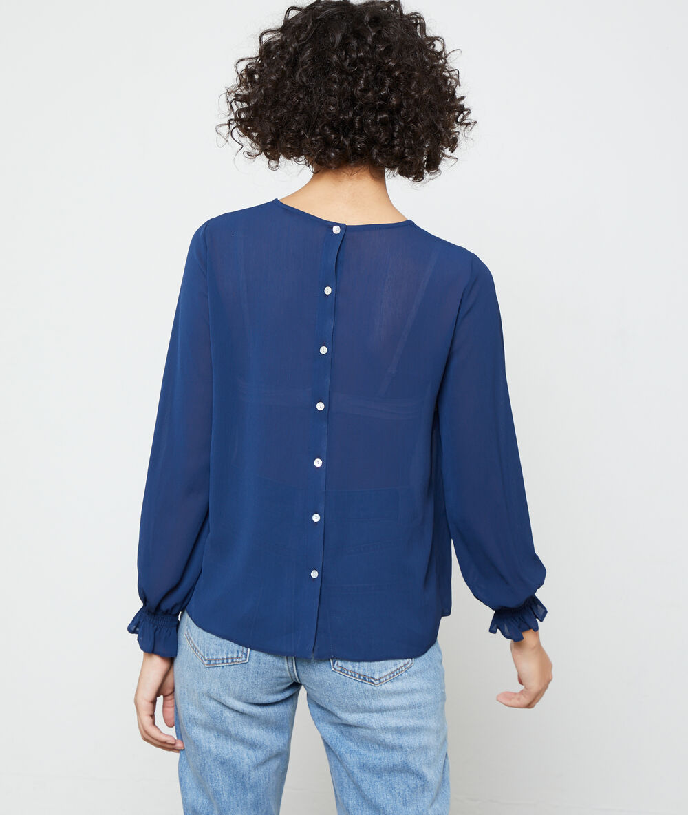 Blusa abotonada a la espalda azul marino.