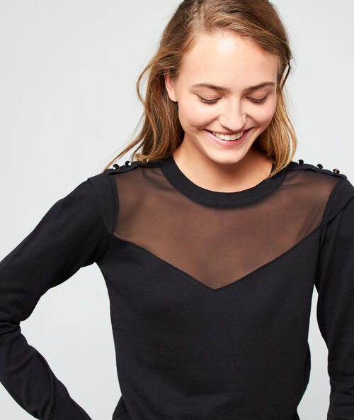 Camiseta escotada efecto transparente negro.