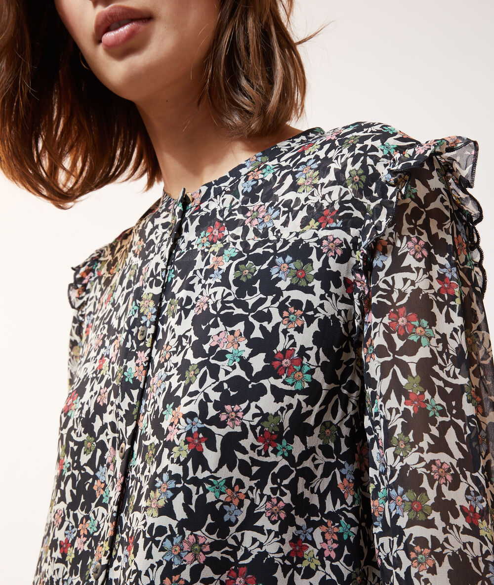 Vestido vaporoso estampado floral negro.