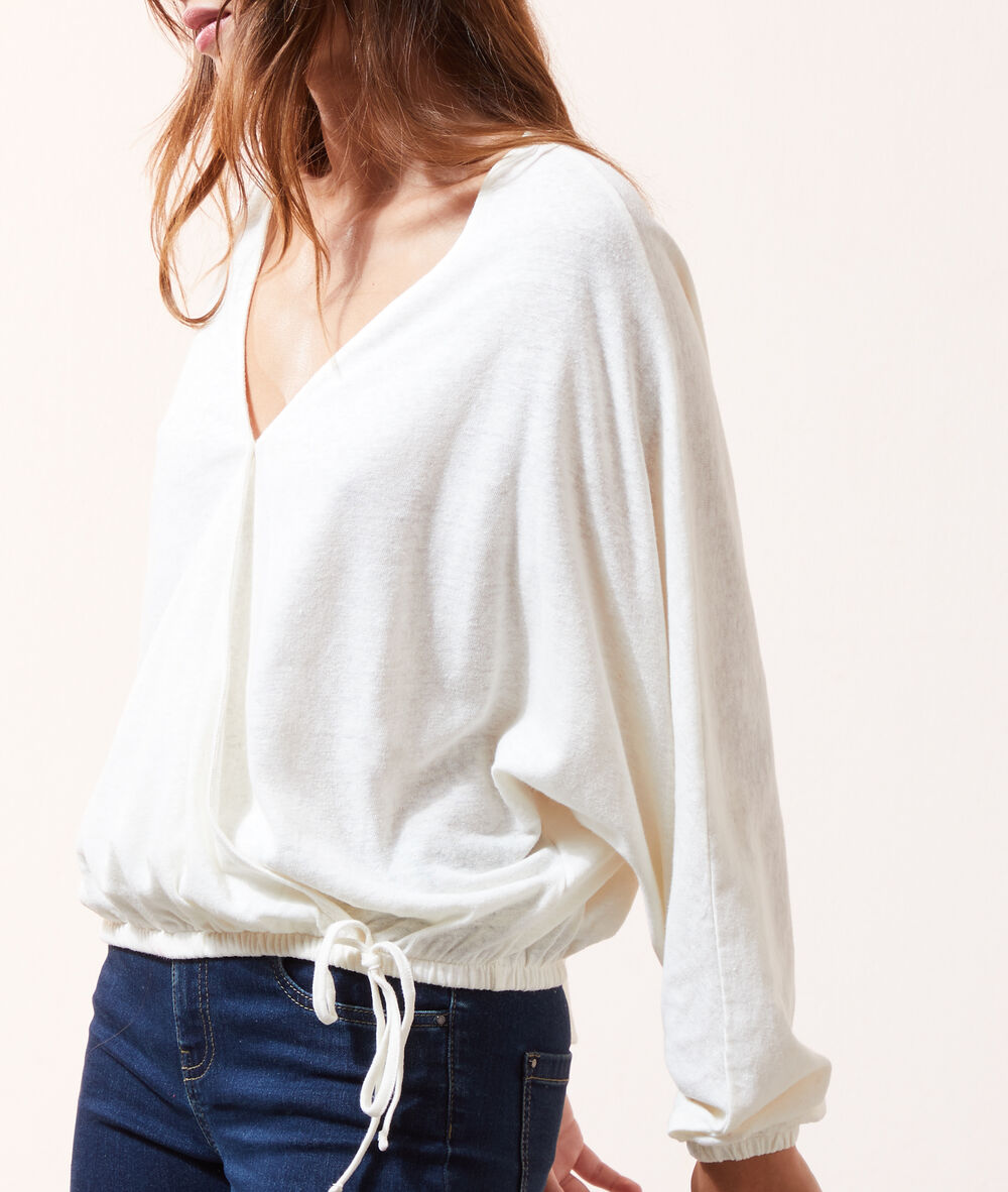 Blusa manga larga escote cruzado crudo.