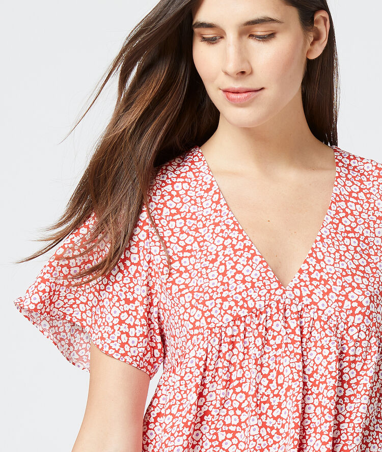 Blusa estampado floral carmín.
